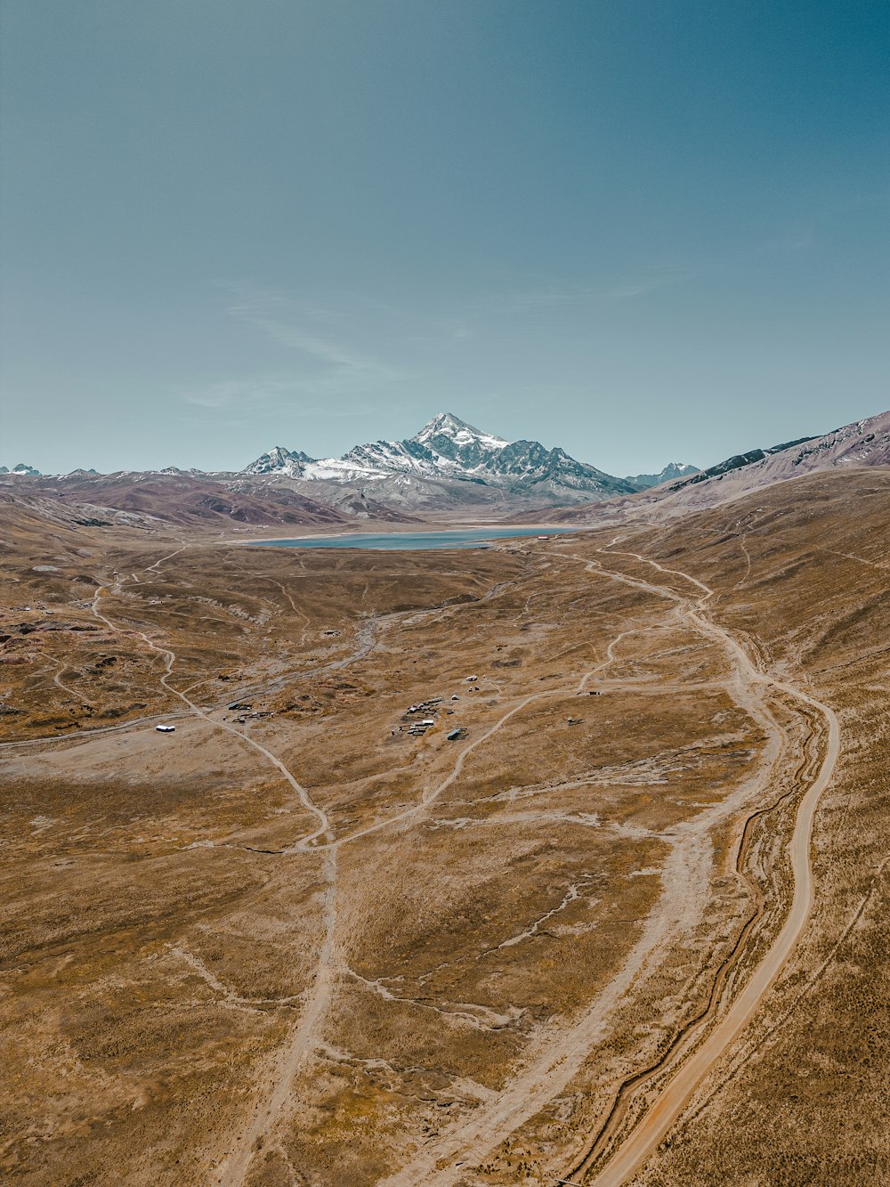 an aerial view of a dirt road in the middle of nowhere