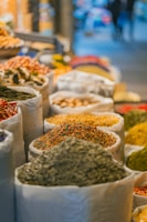 a bunch of bags filled with different types of spices