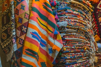 Restored vibrant colors on a vintage kilim rug displayed in a workshop