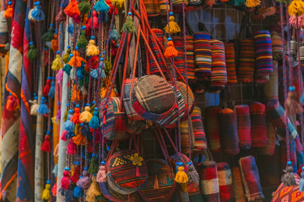 a bunch of colorful items hanging on a wall