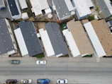 Aerial view of multiple houses with varied roofing styles completed by proroof.