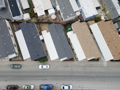 Aerial view of multiple houses with varied roofing styles completed by proroof.