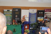 A speaker presenting at an environmental sustainability conference.