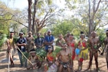 An image showcasing a ceremonial gathering in nature.
