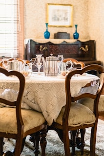 An elegant vintage dining table set in a classic setting.