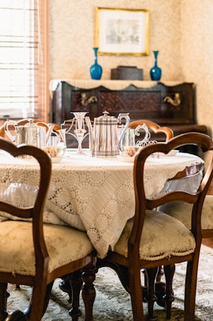 An elegant vintage dining table set in a classic setting.