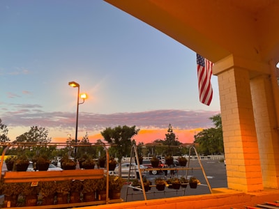 Late afternoon shot capturing the red, white, and blue color scheme reflected in the yard's signage.