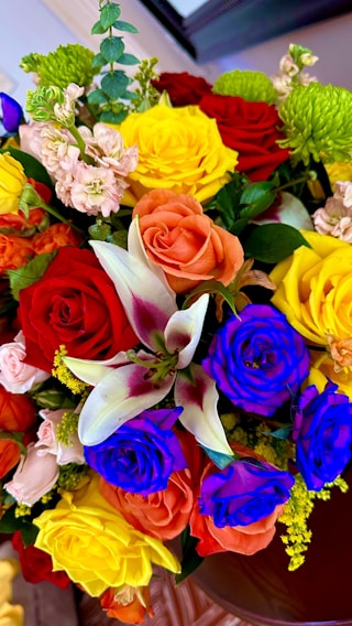A vibrant bouquet of assorted flowers showcasing a spectrum of colors.