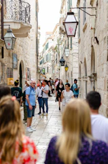 Historic European city street bustling with tourists
