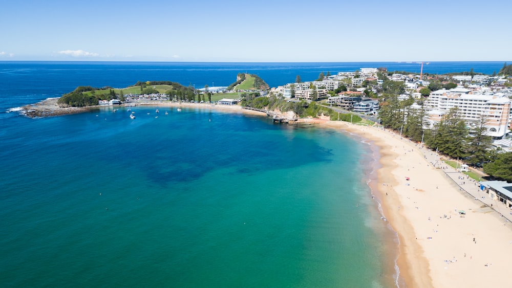 an aerial view of a beach and a city