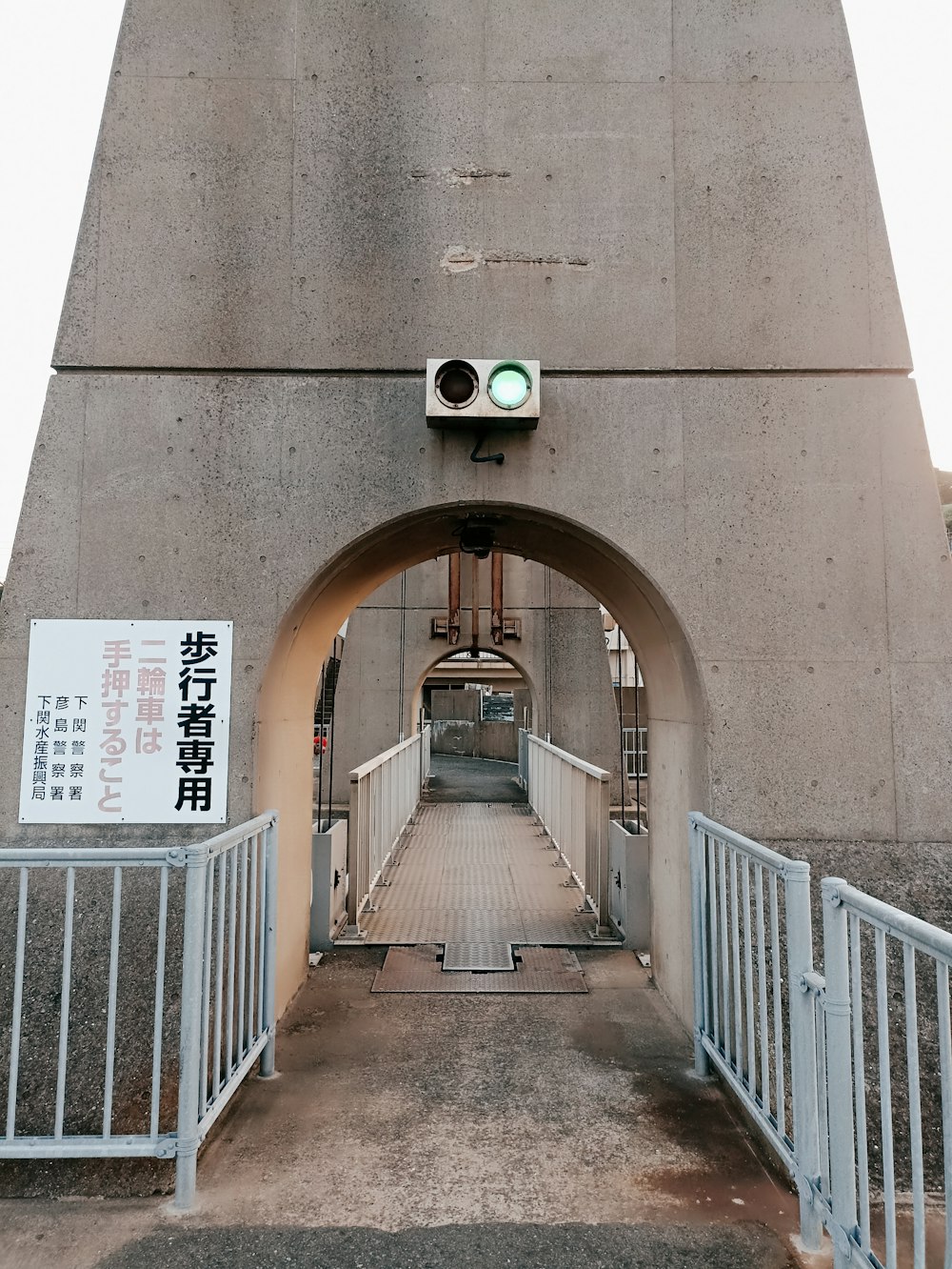 a bridge with a traffic light on top of it