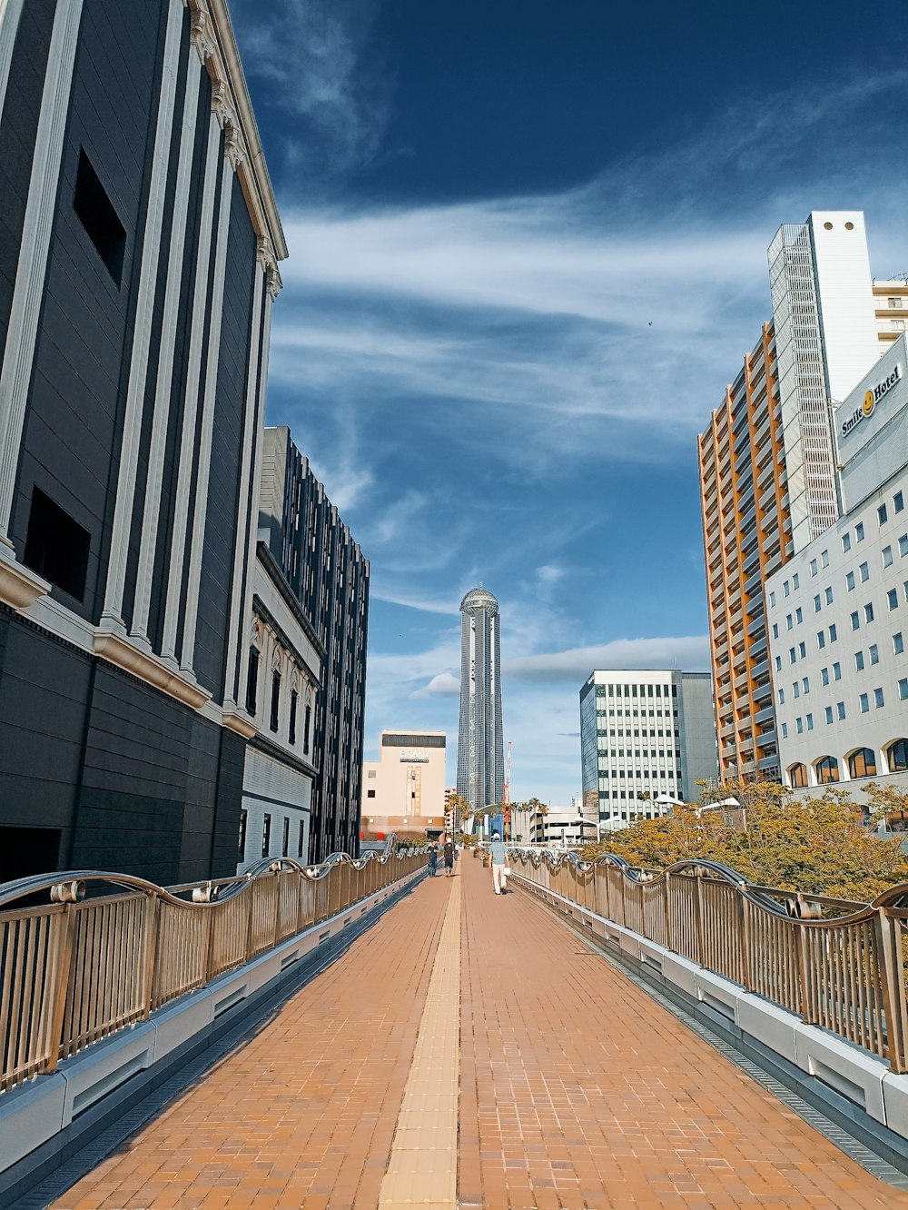 a city street with tall buildings on both sides