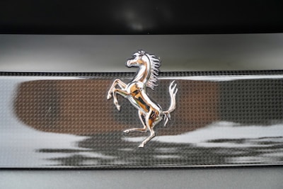 Classic logo plaque of Park Place Motoring engraved on a dark marble surface.