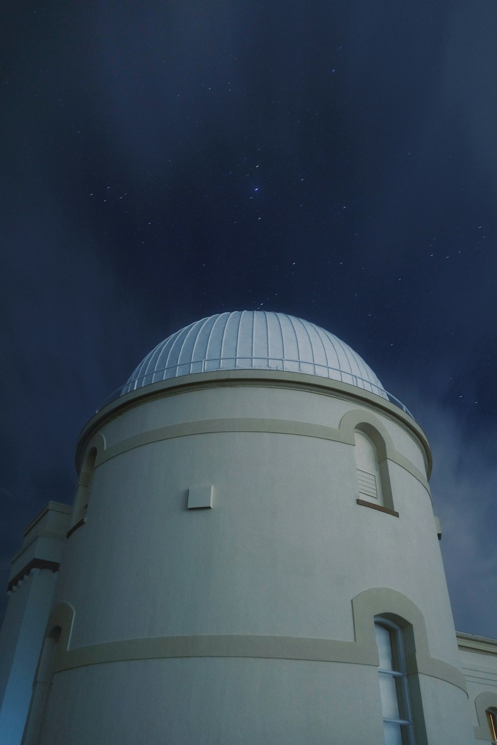 a large white building with a dome on top of it