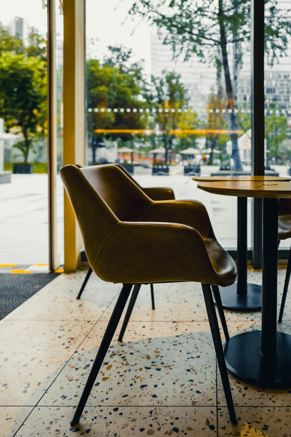 a couple of chairs sitting next to a table