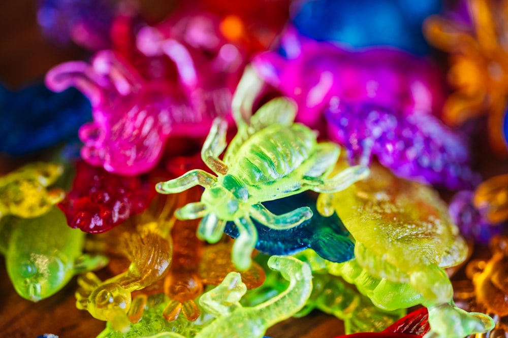 a pile of colorful gummy bears sitting on top of a table
