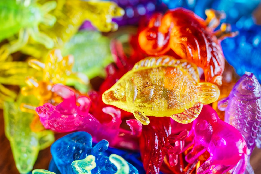 a bunch of colorful gummy bears sitting on top of a table