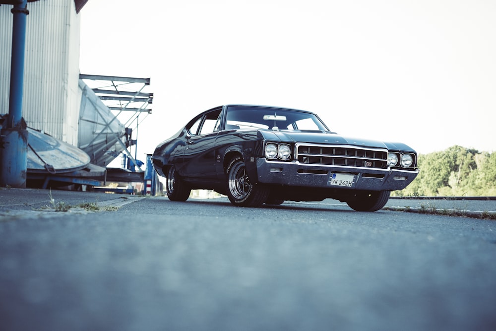 a black car parked on the side of the road