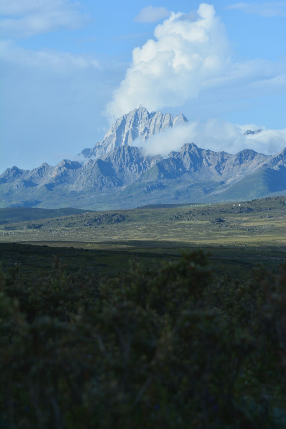 a view of a mountain range from a distance