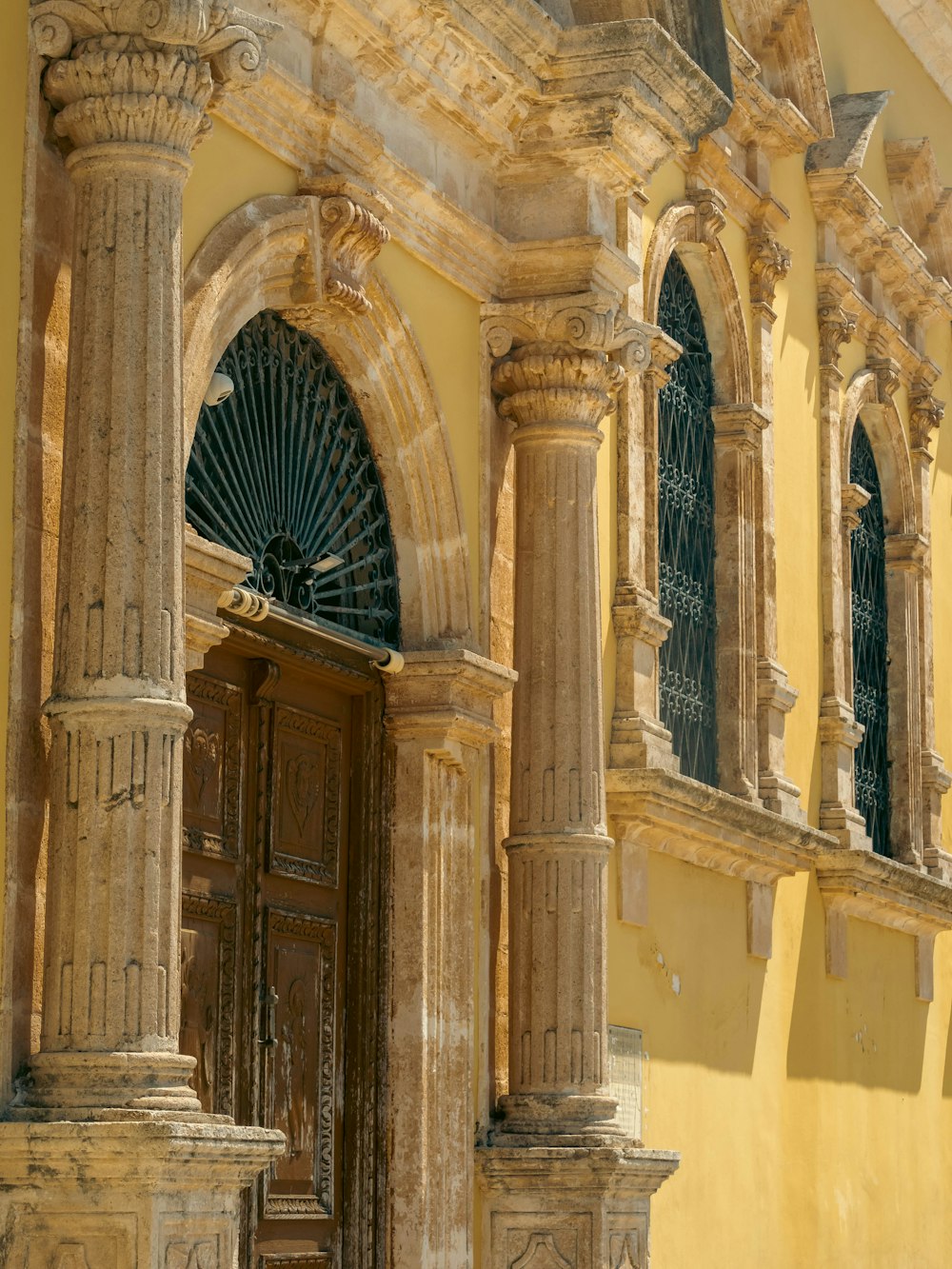 an old building with a clock on the front of it