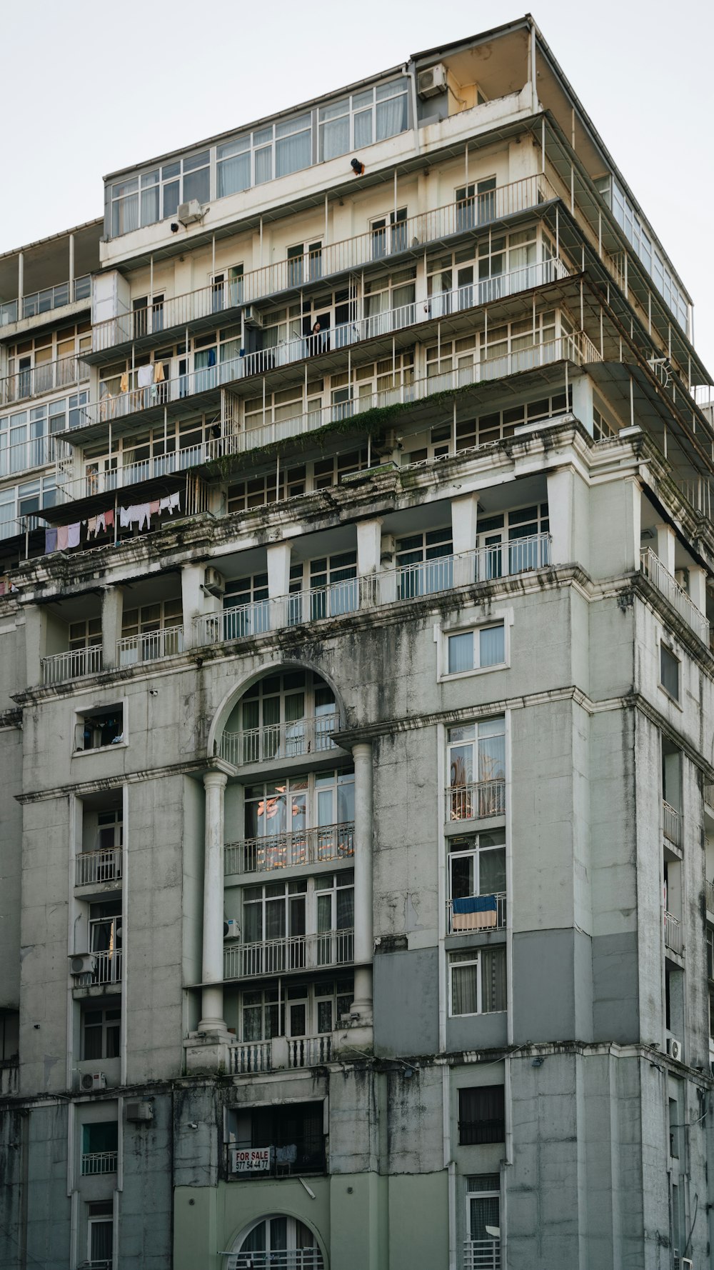 an old building with balconies and balconies on top