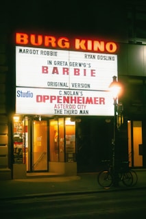 a marquee for a barber shop at night