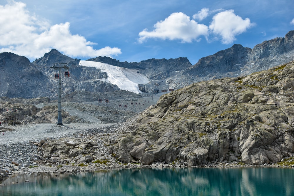 a mountain with a lake in the middle of it