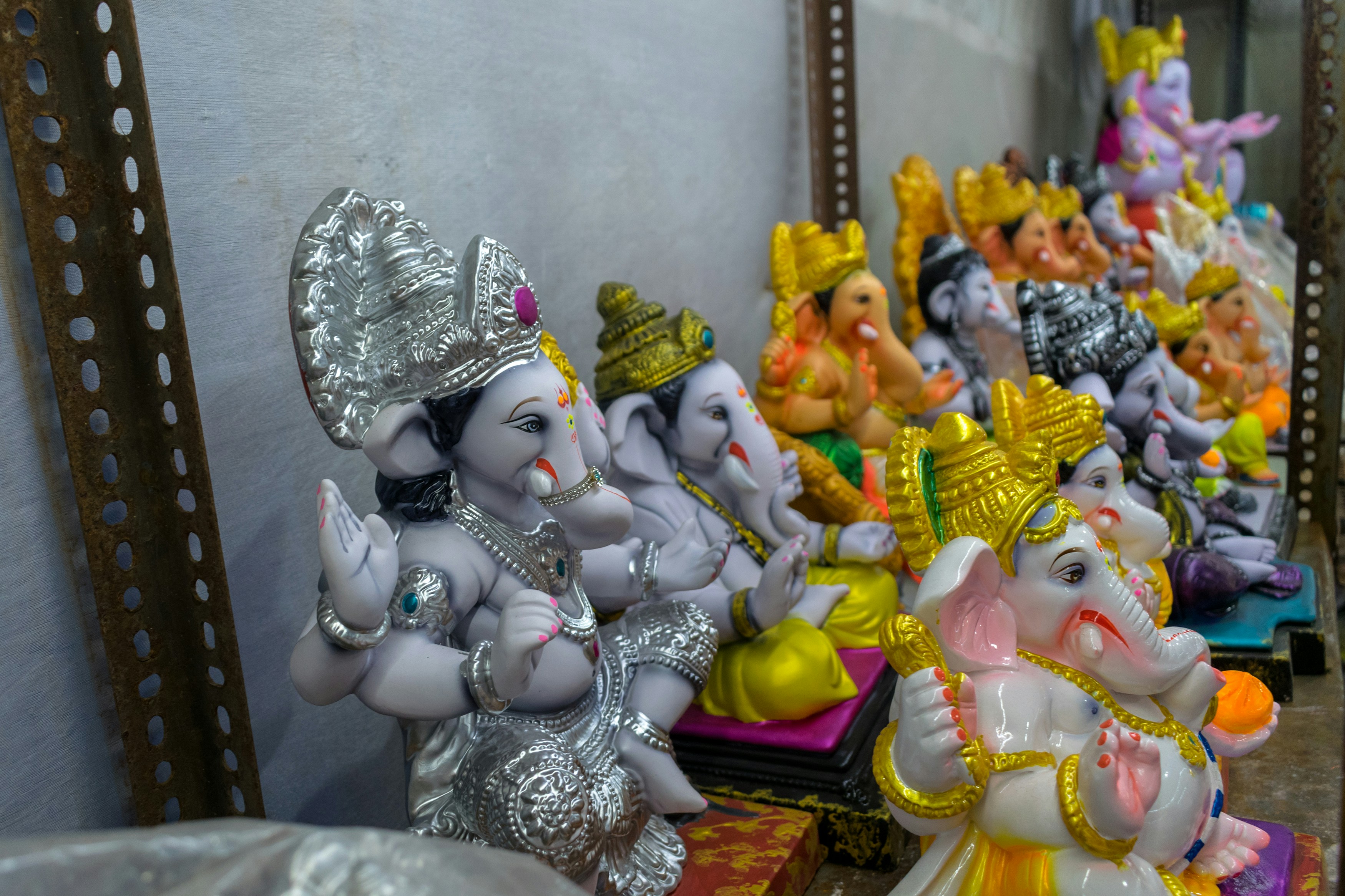 a row of small ganeshi figurines on a table