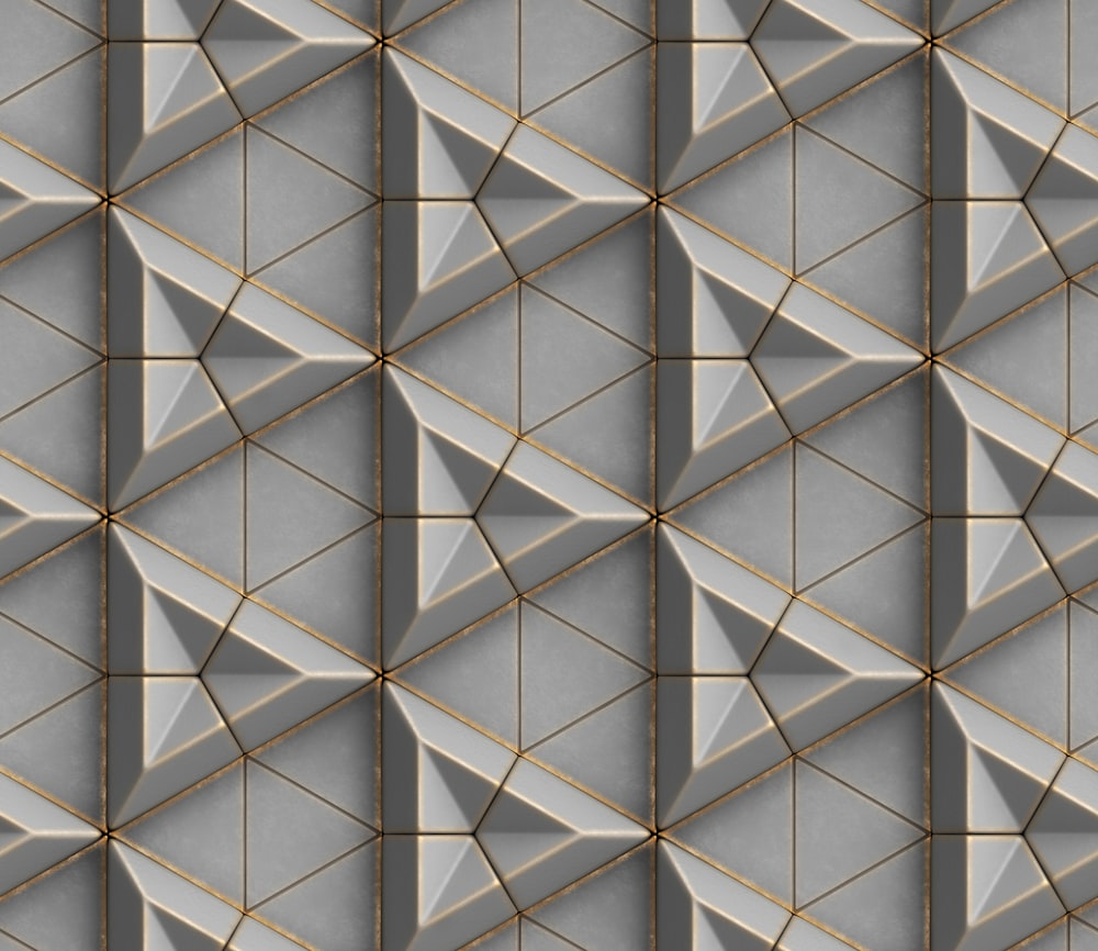 a gray and gold geometric pattern with lines