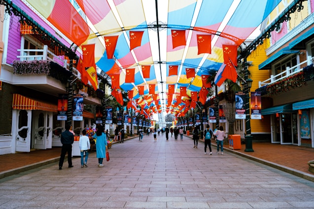 A vibrant street view of Palmas city with promotional banners and happy people engaging in an event.