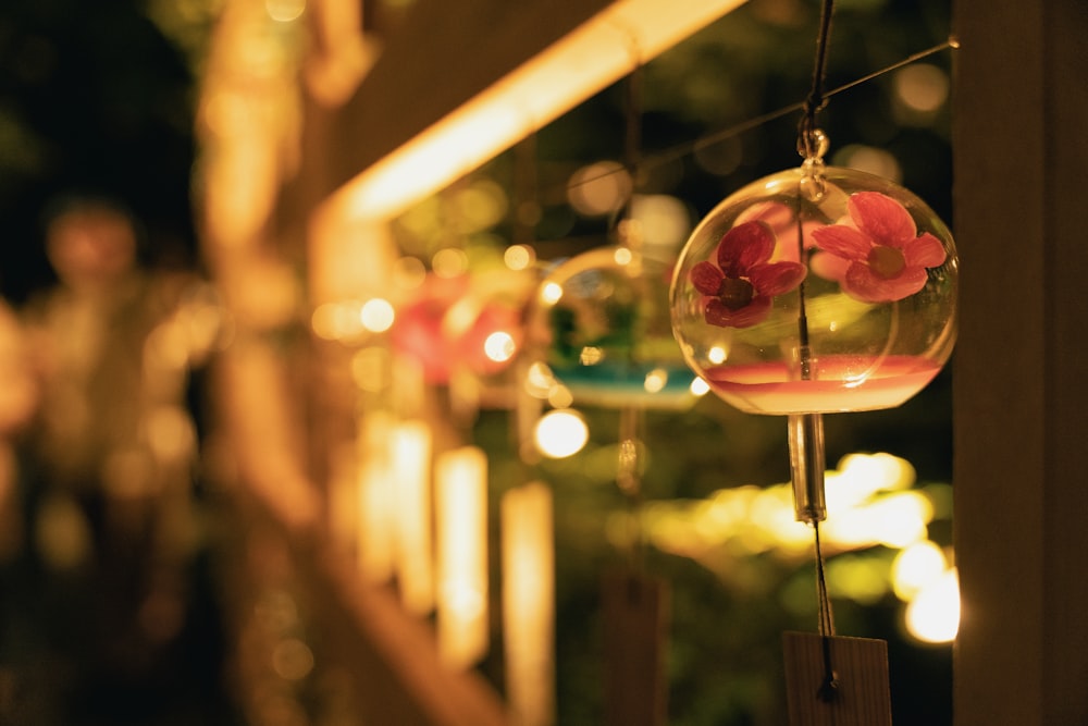 a close up of a glass ball with flowers in it