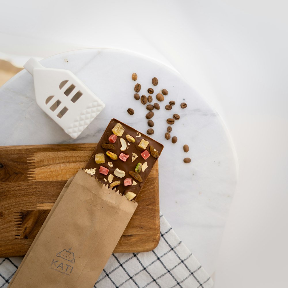 a wooden cutting board topped with lots of food