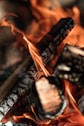 a close up of a cross on fire
