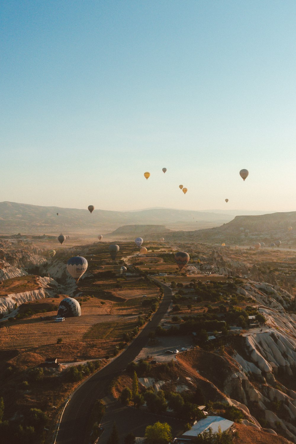 a bunch of hot air balloons flying in the sky