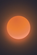 A glowing primordial sun casting warm light over a cosmic nebula.