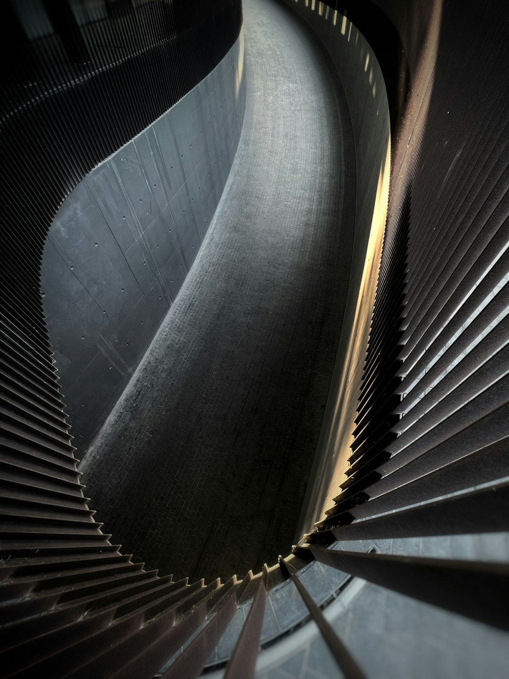 a spiral staircase in a building made of metal