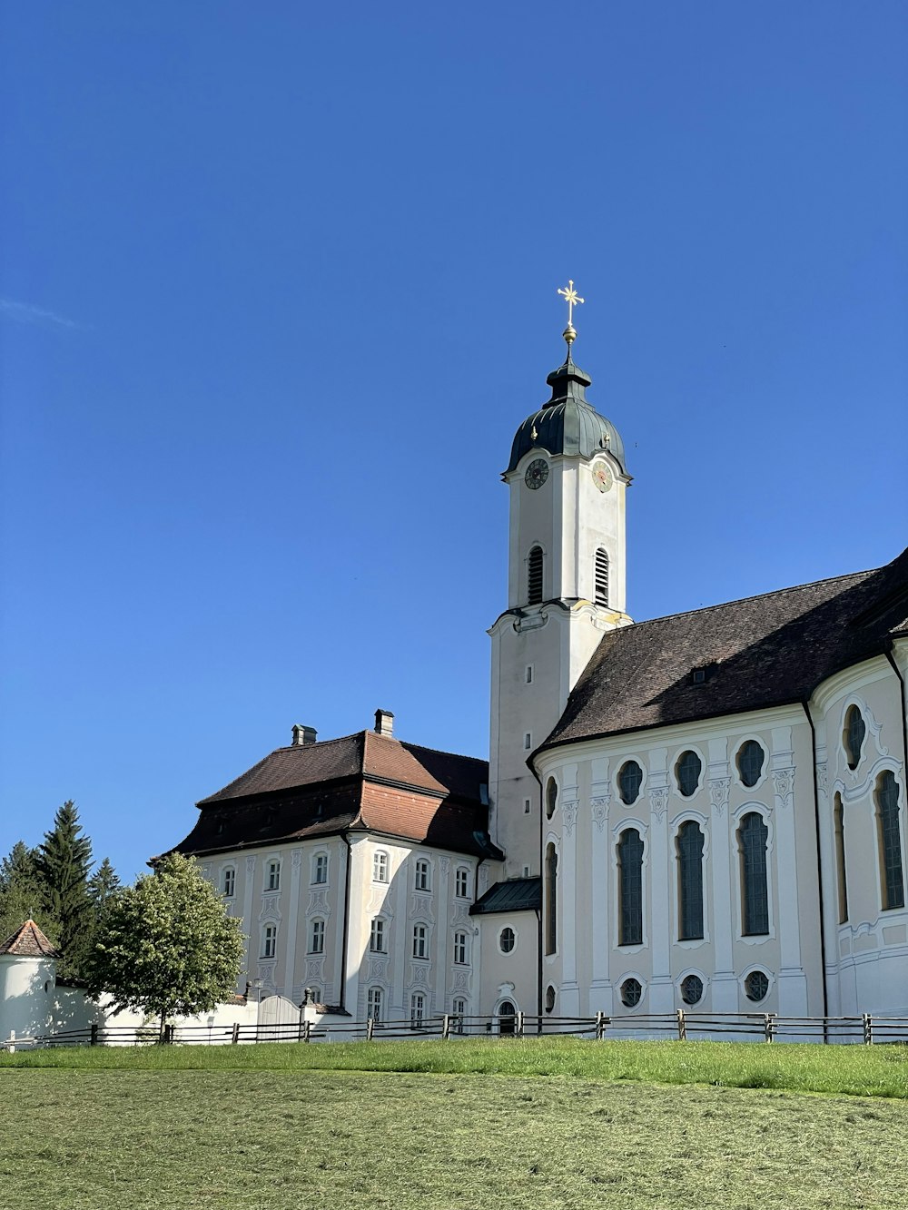 a large white church with a cross on top of it