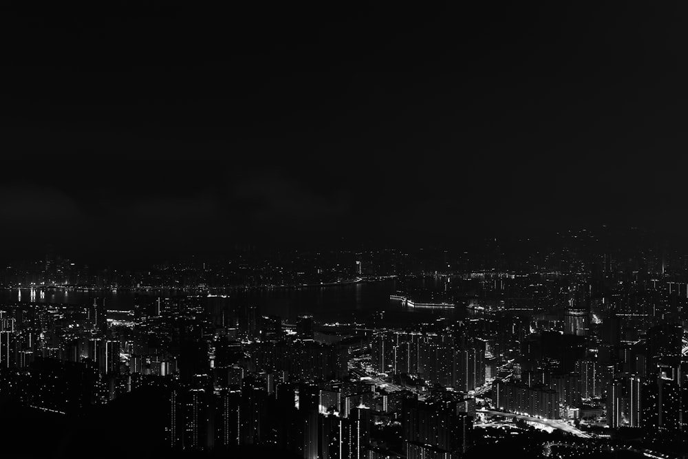 a black and white photo of a city at night