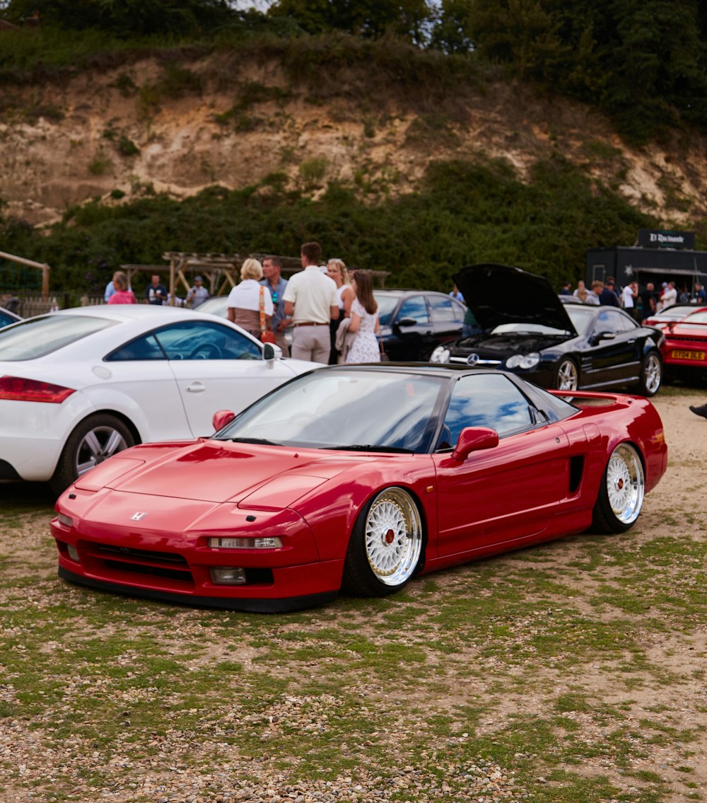 a red sports car parked in a parking lot