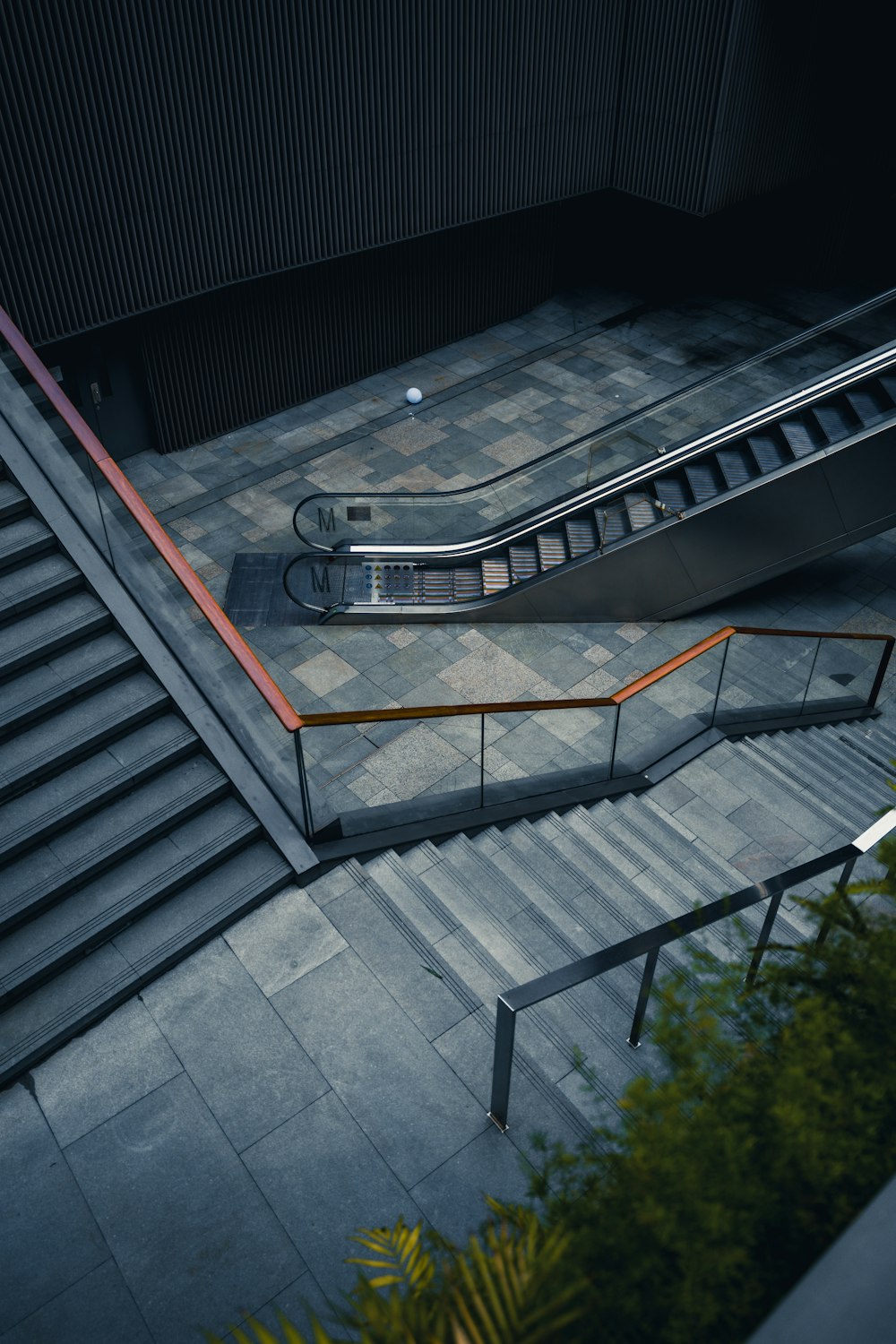 an escalator and stairs in a building