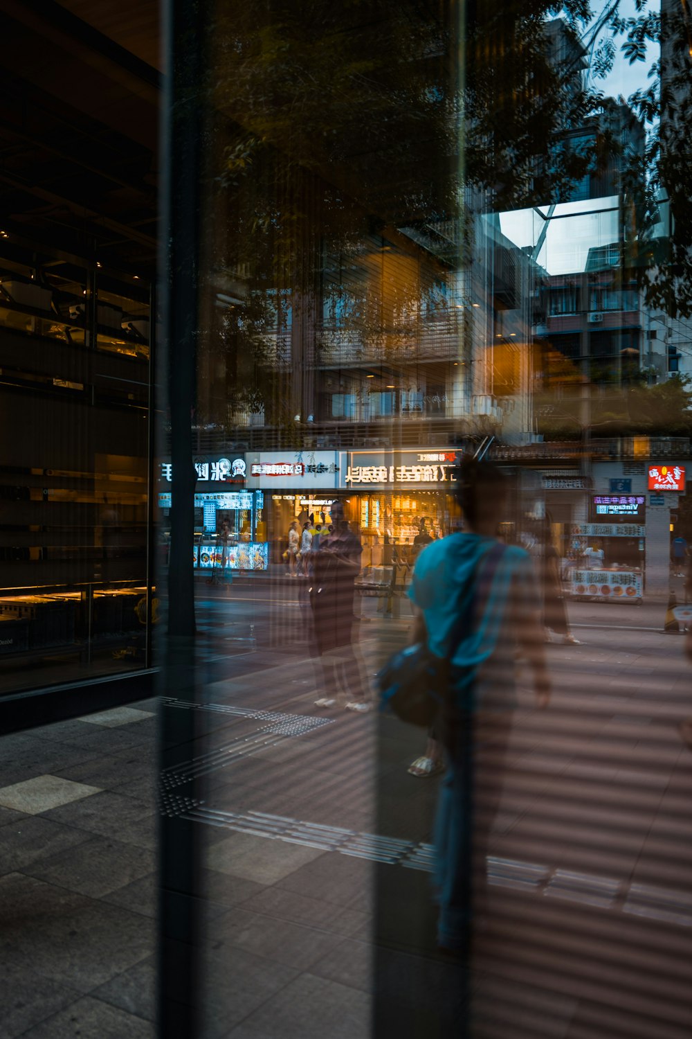 a blurry image of people walking on a sidewalk