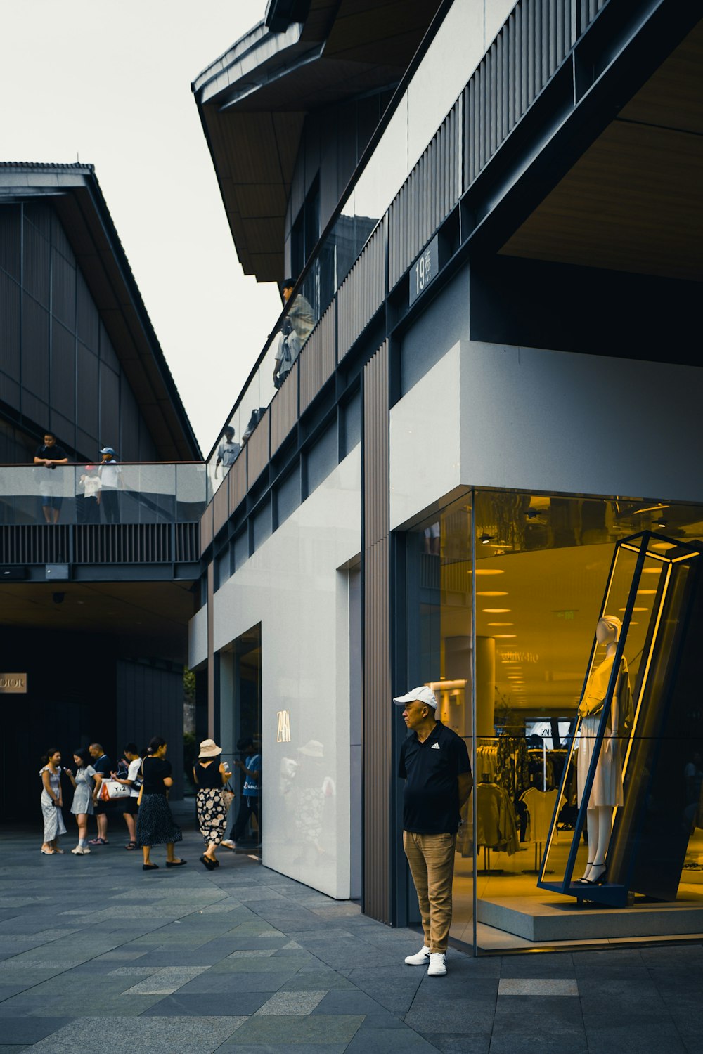 a group of people standing outside of a building