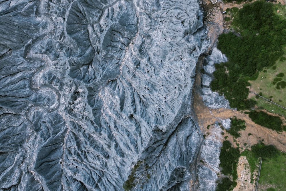 an aerial view of a mountain with a river running through it