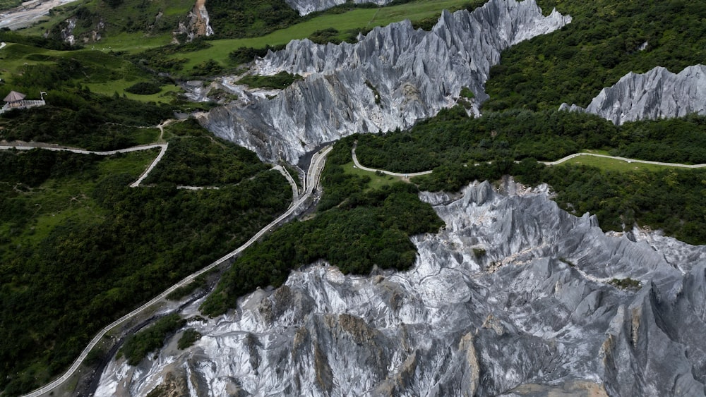 an aerial view of a winding mountain road