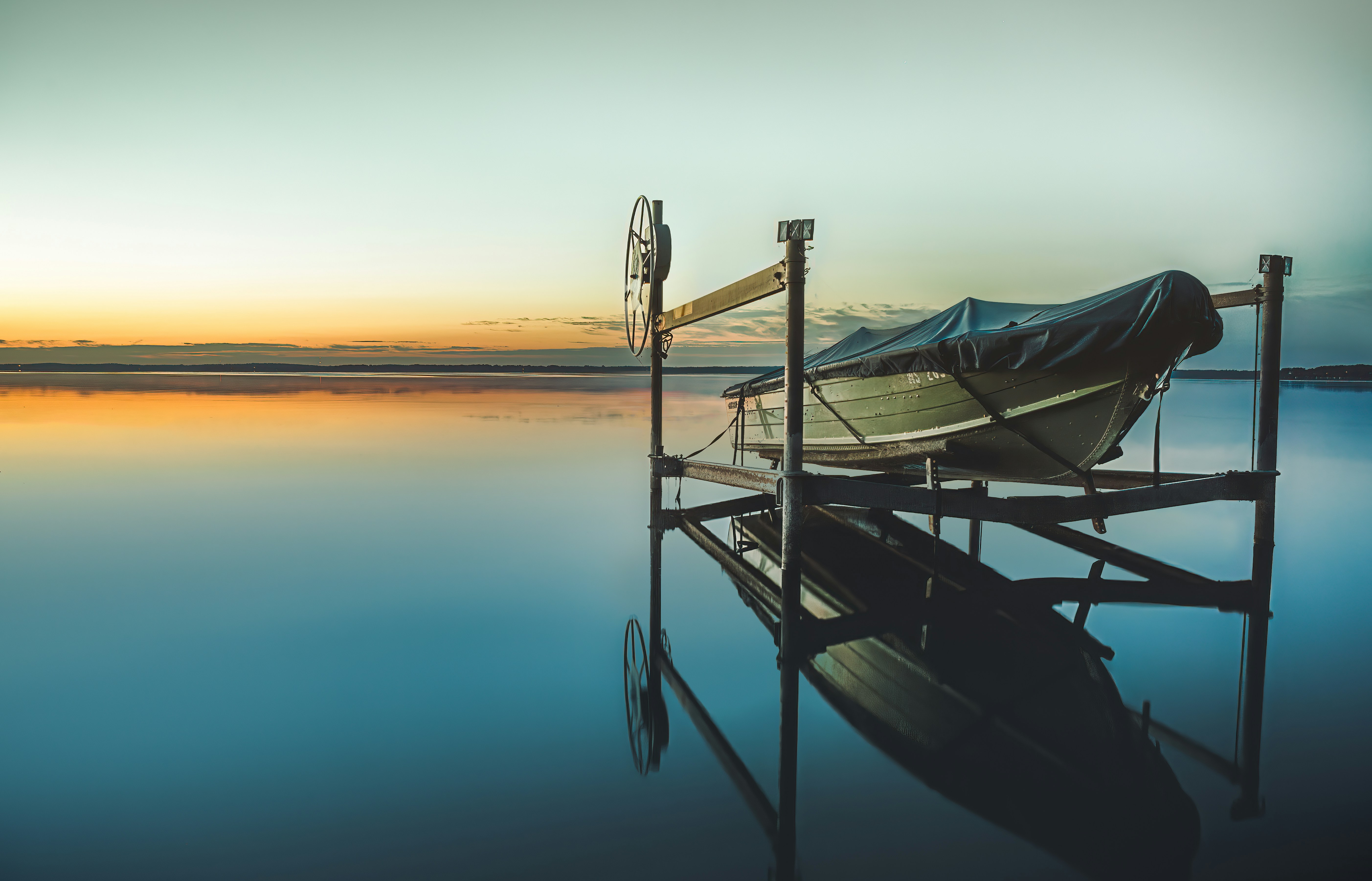 A boat sitting on top of a wooden dock photo Free Lake koshkonong