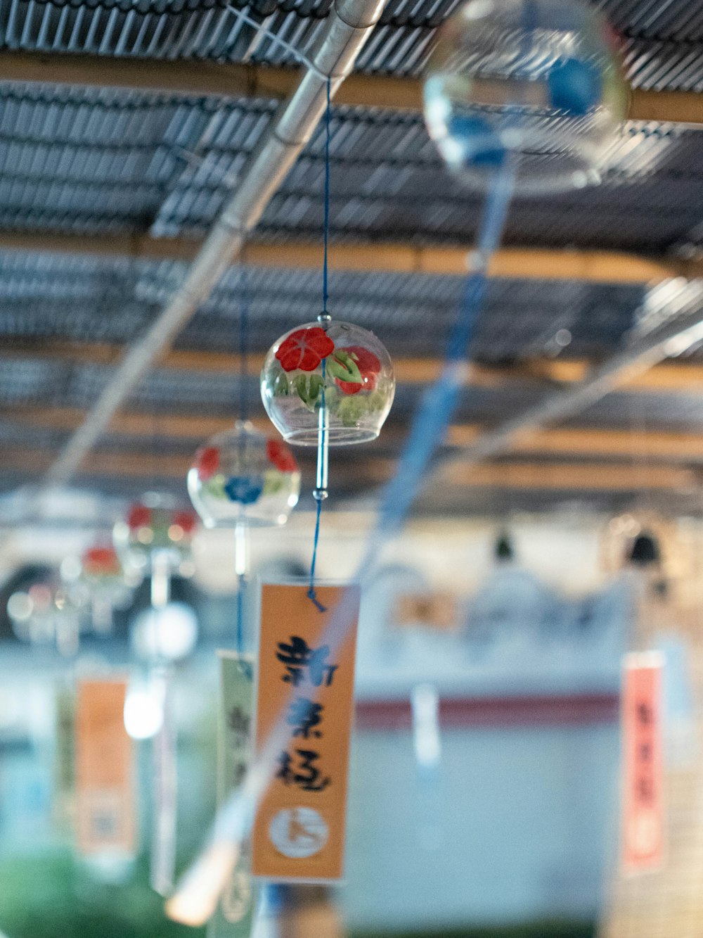 a group of glass balls hanging from a ceiling