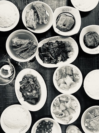 A vibrant spread of traditional Filipino dishes on a wooden table.