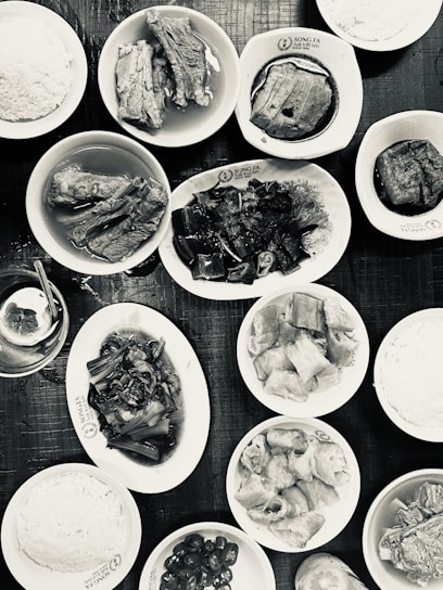 A vibrant spread of traditional Filipino dishes arranged on a wooden table.