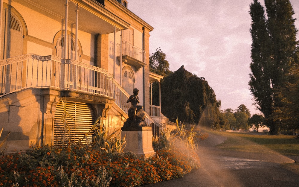 a statue of a man on a horse in front of a building