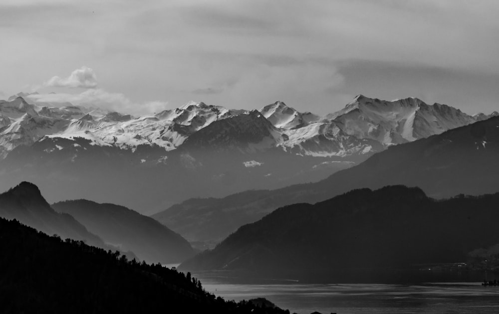 a black and white photo of a mountain range